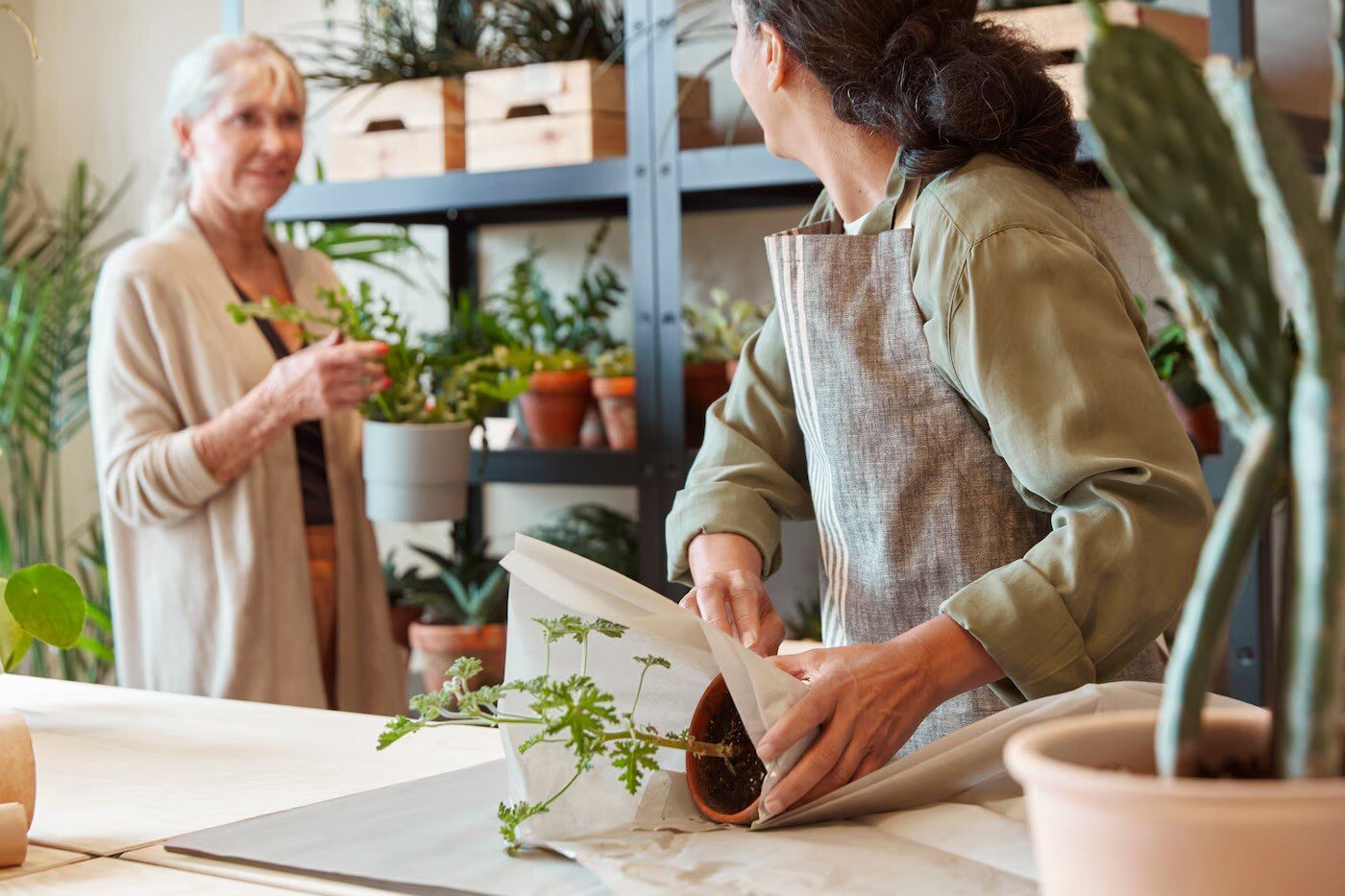 Two women working in a plant store located in a Spanish IKEA 