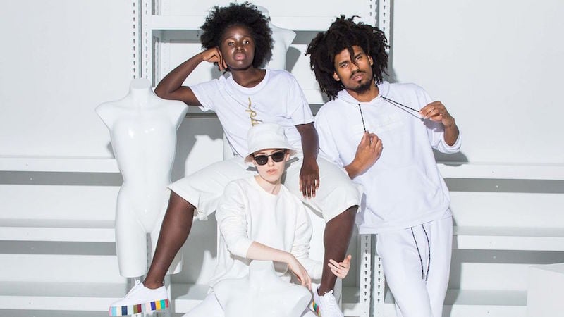 Three models pose in Phluid's clothing