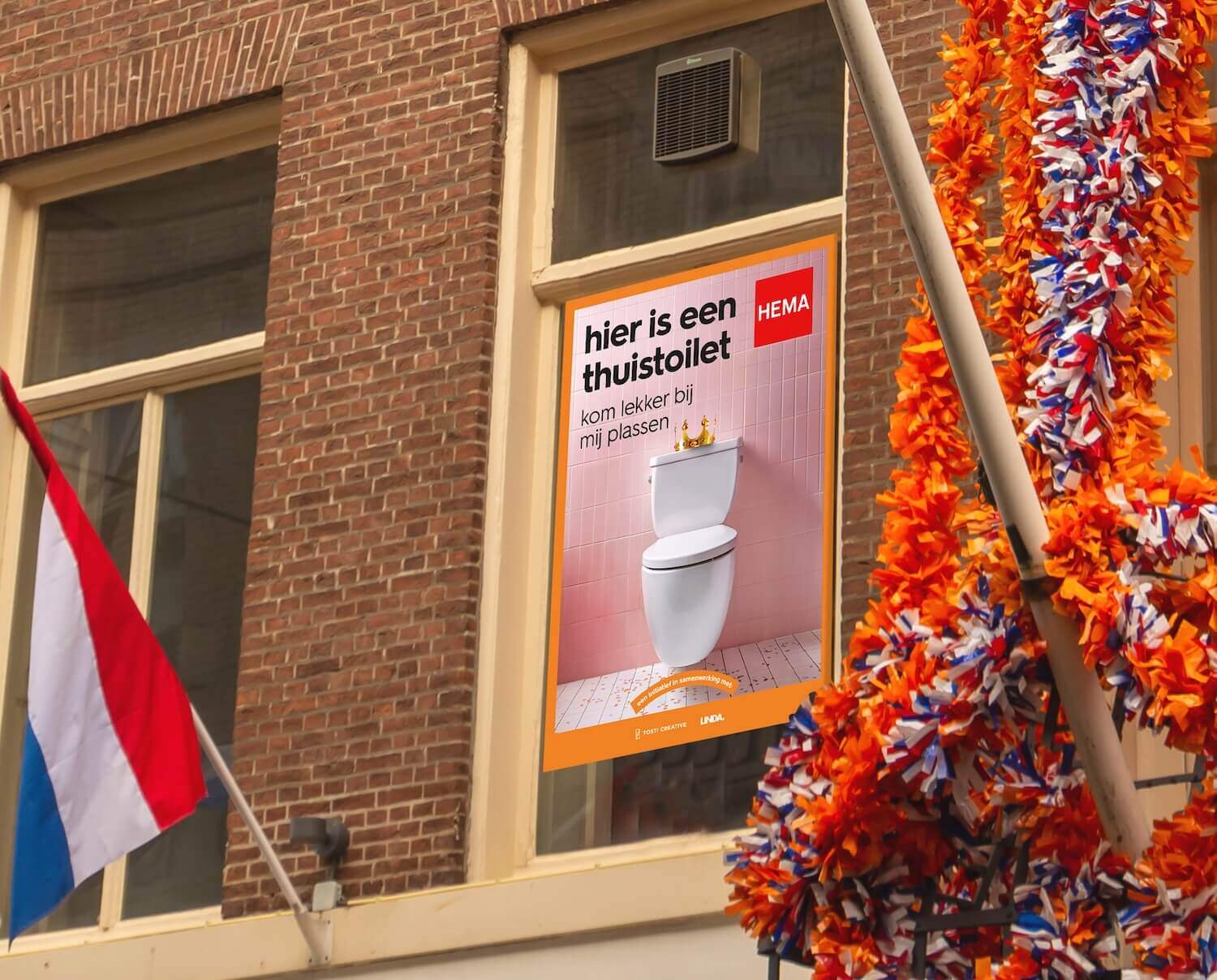 Poster in an apartment window. It features a toilet and invites passersby to use it 